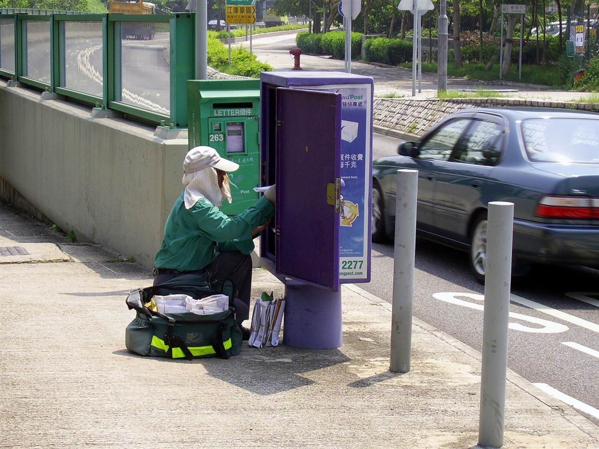 A postal worker collecting mail